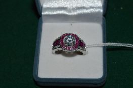 A good decorative silver dress ring, the centre set with a Moissanite, 7mm in diameter, complete