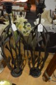 A pair of wrought iron lamp bases.