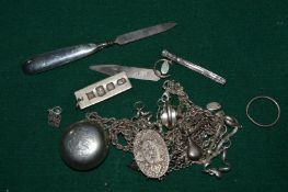 A small group of silver items to include an ingot pendant.