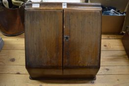 A large oak tabletop stationery box.