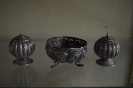 A pair of Eastern white metal pedestal bowls and covers and a similar bowl.