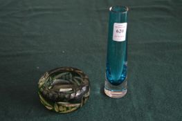 A small blue glass vase and a cut glass and green tinted ashtray.