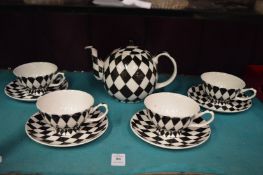 Harlequin pattern part tea service.