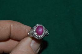 A silver ring set with a natural 4.7ct star ruby, with certificate.