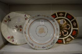 Three decorative porcelain plates.