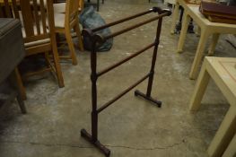 A mahogany towel rail.