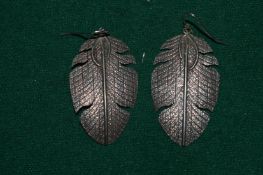 A pair of Herman Smith (20th century American Indian jeweller) silver leaf shaped earrings.