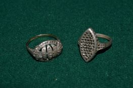 Two silver and gold rings.
