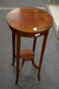 An inlaid mahogany two-tier circular occasional table or plant stand.