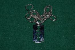 A stainless steel razor blade shaped pendant and chain.