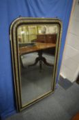 A Victorian pier mirror with ebonised and silvered frame.