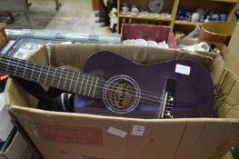 A small guitar and other items.