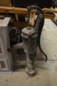 An old cast iron garden pump.