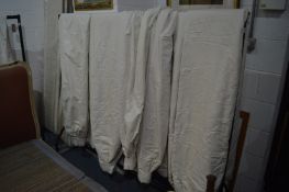 Seven large cream curtains approx 275cm long x 243cm at the bottom, gathered top approx 115cm,