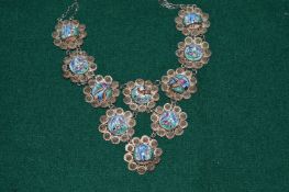 A filigree silver and porcelain necklace.