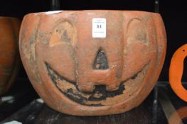 A pumpkin shaped pottery jardiniere.