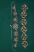 A filigree bracelet and necklace.