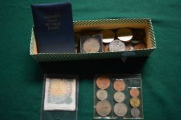 Various coins and bank notes.