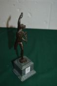 A small cast bronze depicting Mercury on a square marble base.