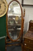 A modern mahogany framed oval cheval mirror.