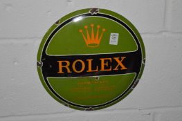 A reproduction Rolex enamel sign.