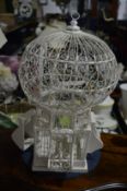 An Indian wire work bird cage.