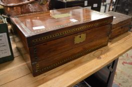 A good Victorian rosewood and brass inlaid writing slope.