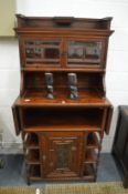 A 19th century rosewood side cabinet, the upper section with pair of glazed doors, above a base with
