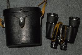 Cased pair of Pentax binoculars.