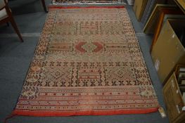 A flat weave rug with geometric design, 200cm x 142cm.