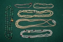 Pearl and other necklaces.