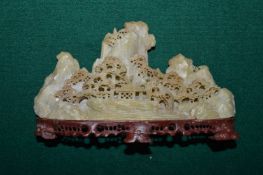 A small Chinese carved soap stone boulder group.