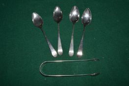 Four silver teaspoons and a pair of sugar tongs.
