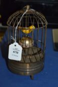 A novelty bird cage clock.