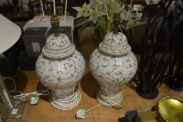 A pair of pottery table lamps.