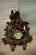 A cast metal mantle clock.