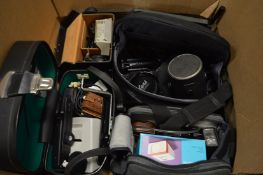 Two boxes of cameras and camera equipment.