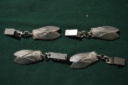 Four insect shaped holders.