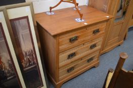 A Victorian satin walnut three drawer chest.