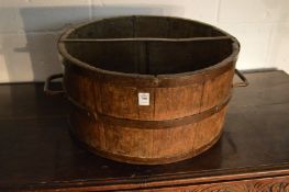 A large metal bound oak grain measure with twin wrought iron handles.