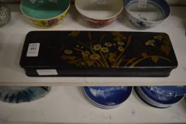 A Japanese lacquer box and cover.