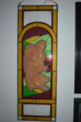 A pair of decorative stain glass panels depicting young ladies in relief.