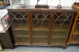 A mahogany three door astragal glazed display cabinet.