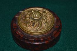 A brass and hard stone circular bell push.