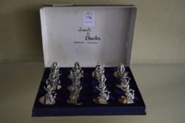 A cased set of twelve Thai place name holders with original box.