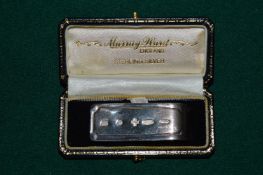 A boxed silver money clip.