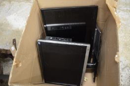 Two small flat screen TV's and a vacuum cleaner.