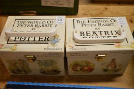 Two sets of Beatrix Potter books.