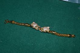A gilded double head panther bracelet.