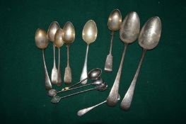 A collection of silver spoons.